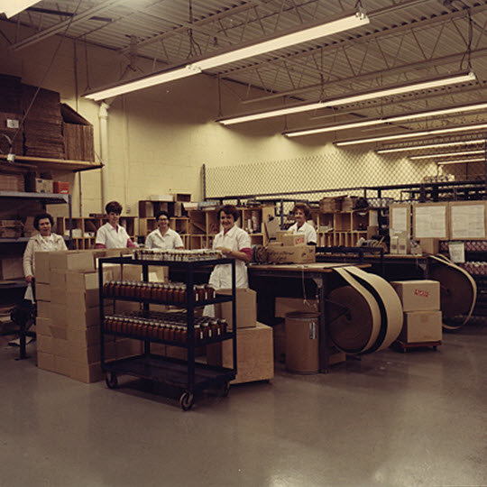 employees working on the assembly line in the factory