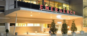 An emergency building with a large sign, highlighting the importance of immediate care for migraine patients.