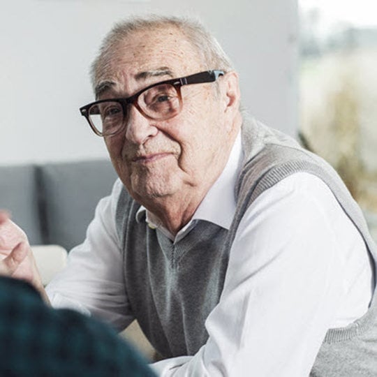 an older man with glasses