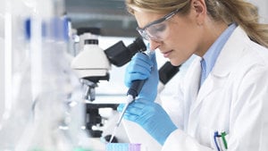 a woman in a laboratory tests a sample