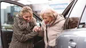 helping a woman in car