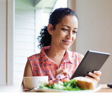 woman looking at tablet